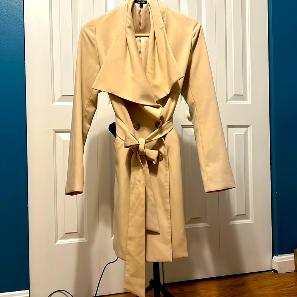 Tan light coat fits small to medium.